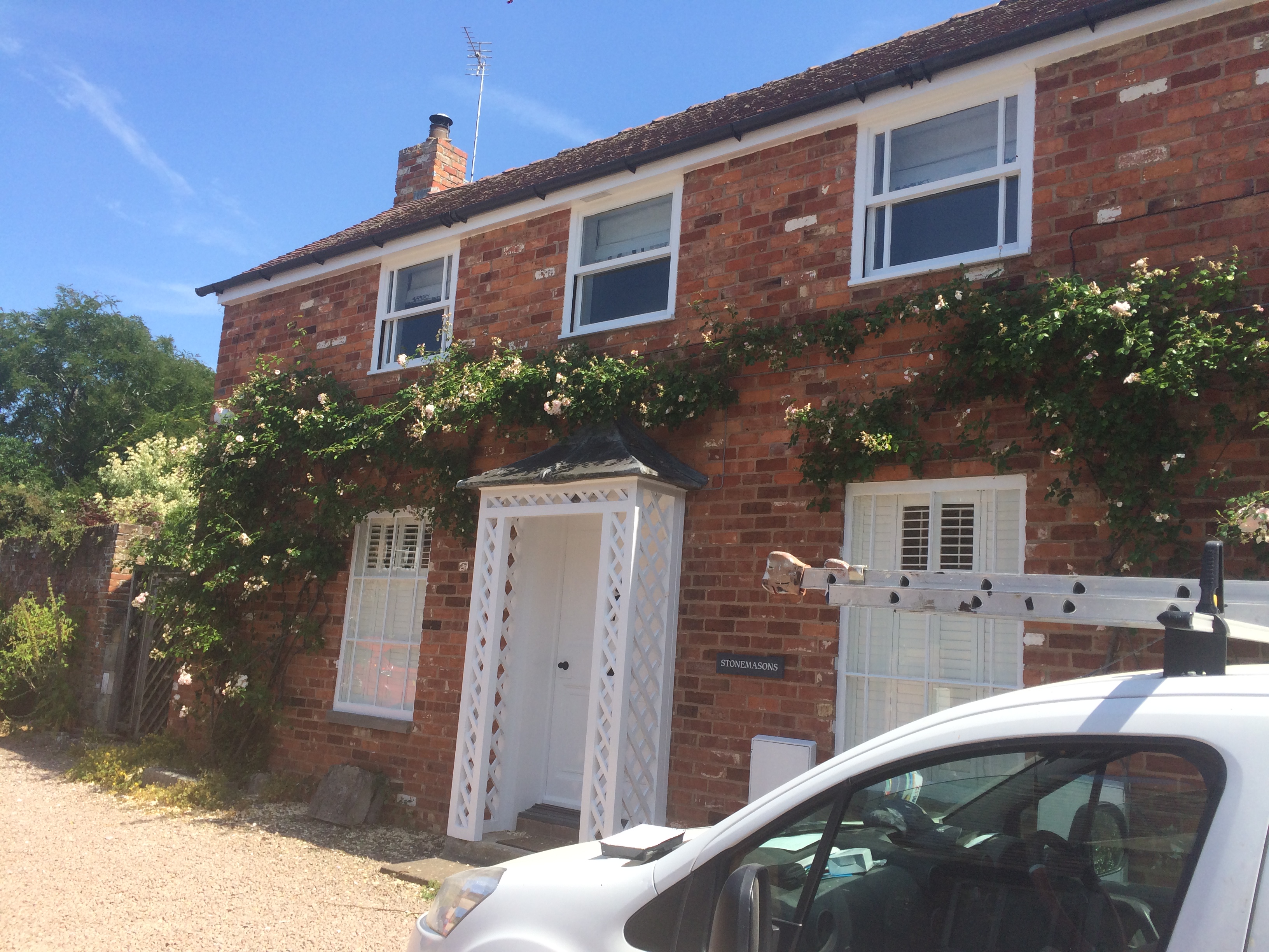 Brick cottage exterior woodwork painting