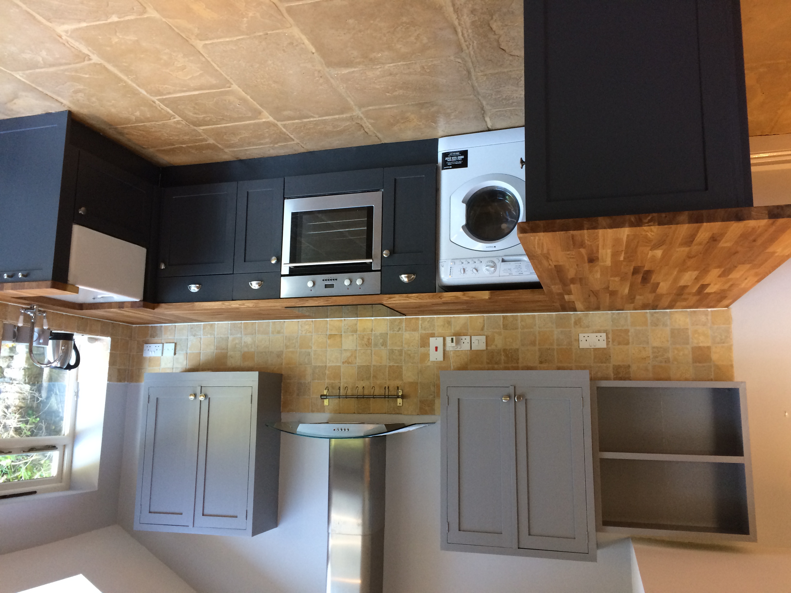 Kitchen cabinet painting in dark blue
