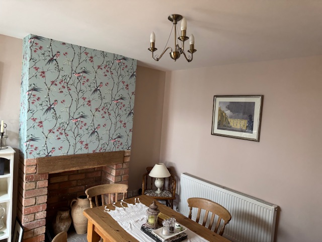 Feature wallpaper on chimney breast